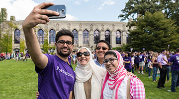 A family taking a selfie at Wildcat Welcome